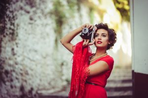 stylish-woman-with-retro-camera