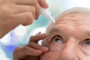 doctor-pouring-some-eye-drops-patient