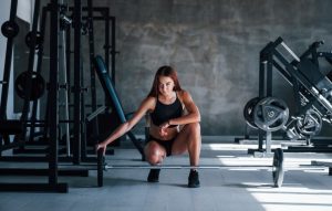 young-fitness-woman-with-slim-type-body-black-sportive-clothes-is-gym